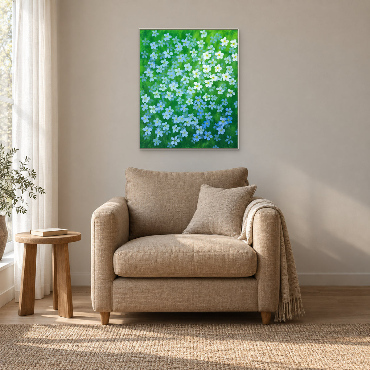 Blue Flax in a white floating frame above a warm beige reading armchair beside a window
