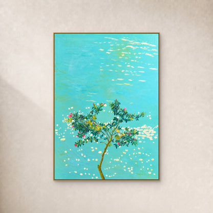 A flowering tree and warm white reflections over turquoise water, in a slim gold floating frame on an ivory wall