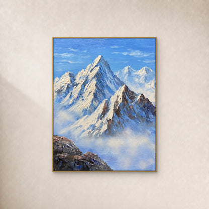 Tableau de montagnes bleues et ivoire, cadre flottant doré sur un mur ivoire