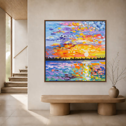 Colorful square sunset painting in a slim wood floating frame above a curved hallway bench