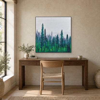 Black-framed teal forest painting above a dark wooden desk and a simple wooden chair