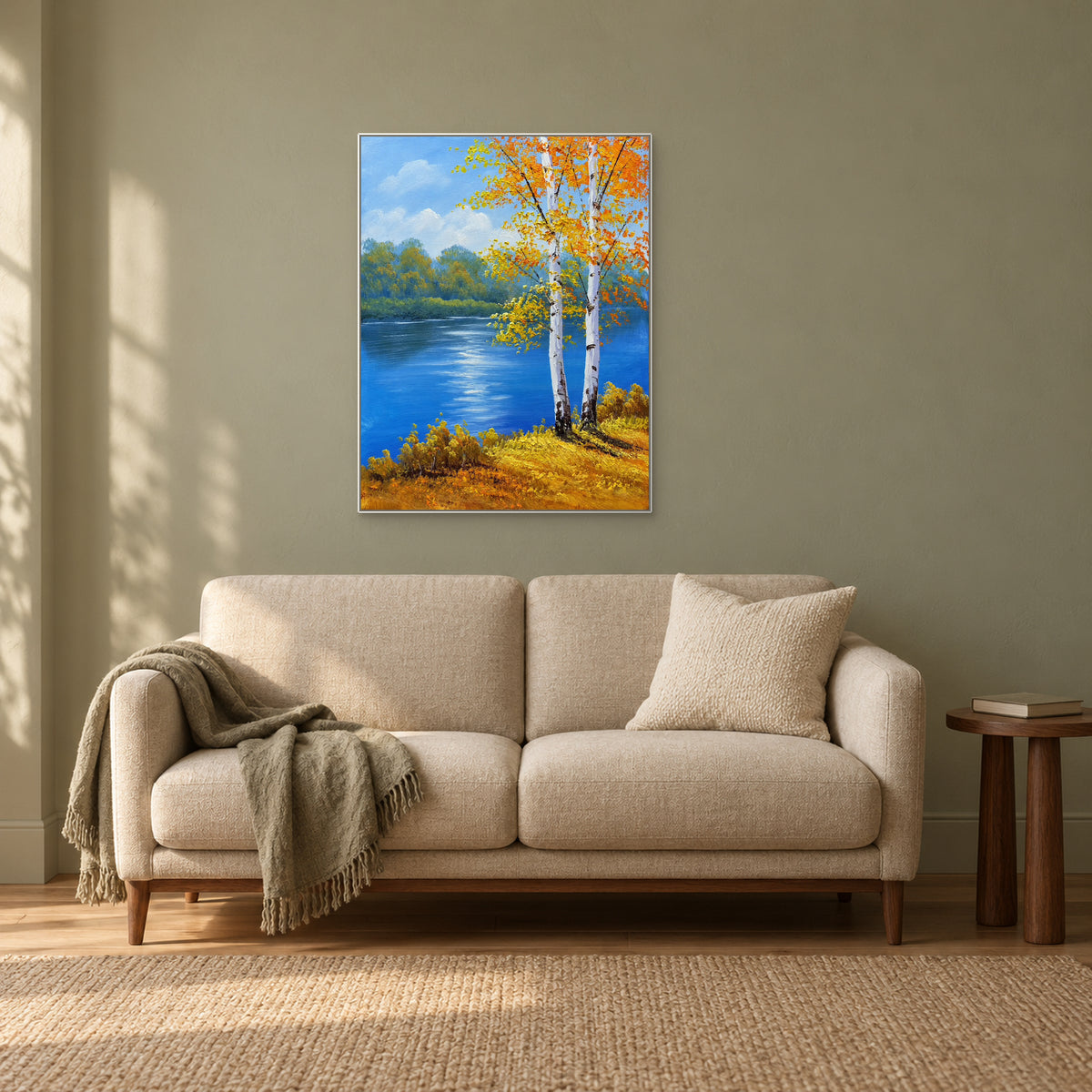 Paysage de rivière en automne à cadre blanc, au-dessus d’une banquette crème près d’une fenêtre