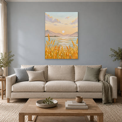 Vertical harvest landscape in a silver-tone frame above a cream sofa on a blue-grey wall