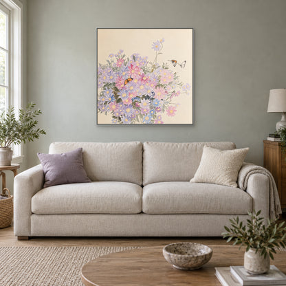 Pastel square floral artwork in a silver-look floating frame above an oatmeal sofa