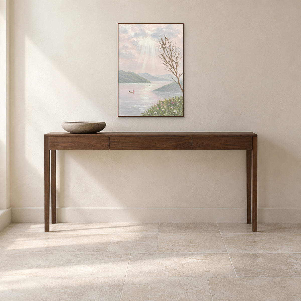 Soft pink lake painting in a walnut-tone frame above a narrow entryway console