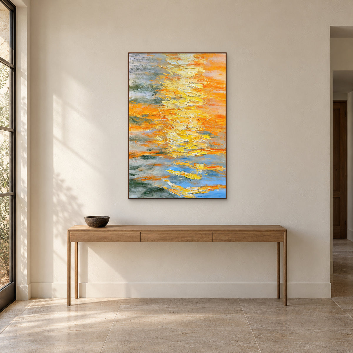 Saffron Layers in a walnut-toned frame centred above an oak entryway console with a low dark bowl