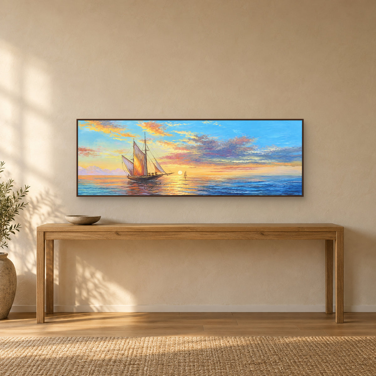 Panoramic sailing boat painting in a walnut-tone frame above a long oak console