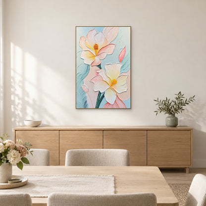 Cream and pink floral relief in a champagne-coloured frame above a long wooden sideboard in a light dining room