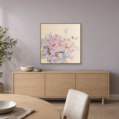 Square wildflower painting in a champagne-look floating frame above an oak dining sideboard