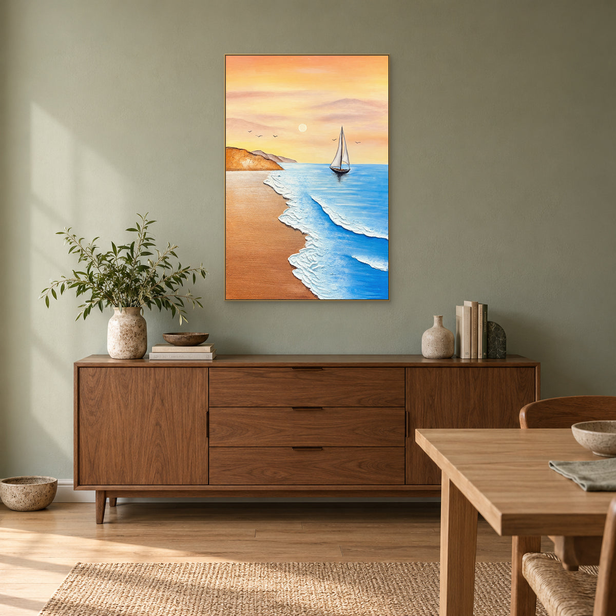 Vertical white-sail painting in a champagne-tone frame above a walnut sideboard on a muted green wall