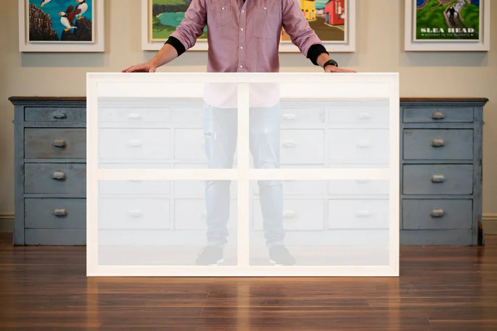 Back of a stretched canvas showing its wooden inner frame and supporting bars