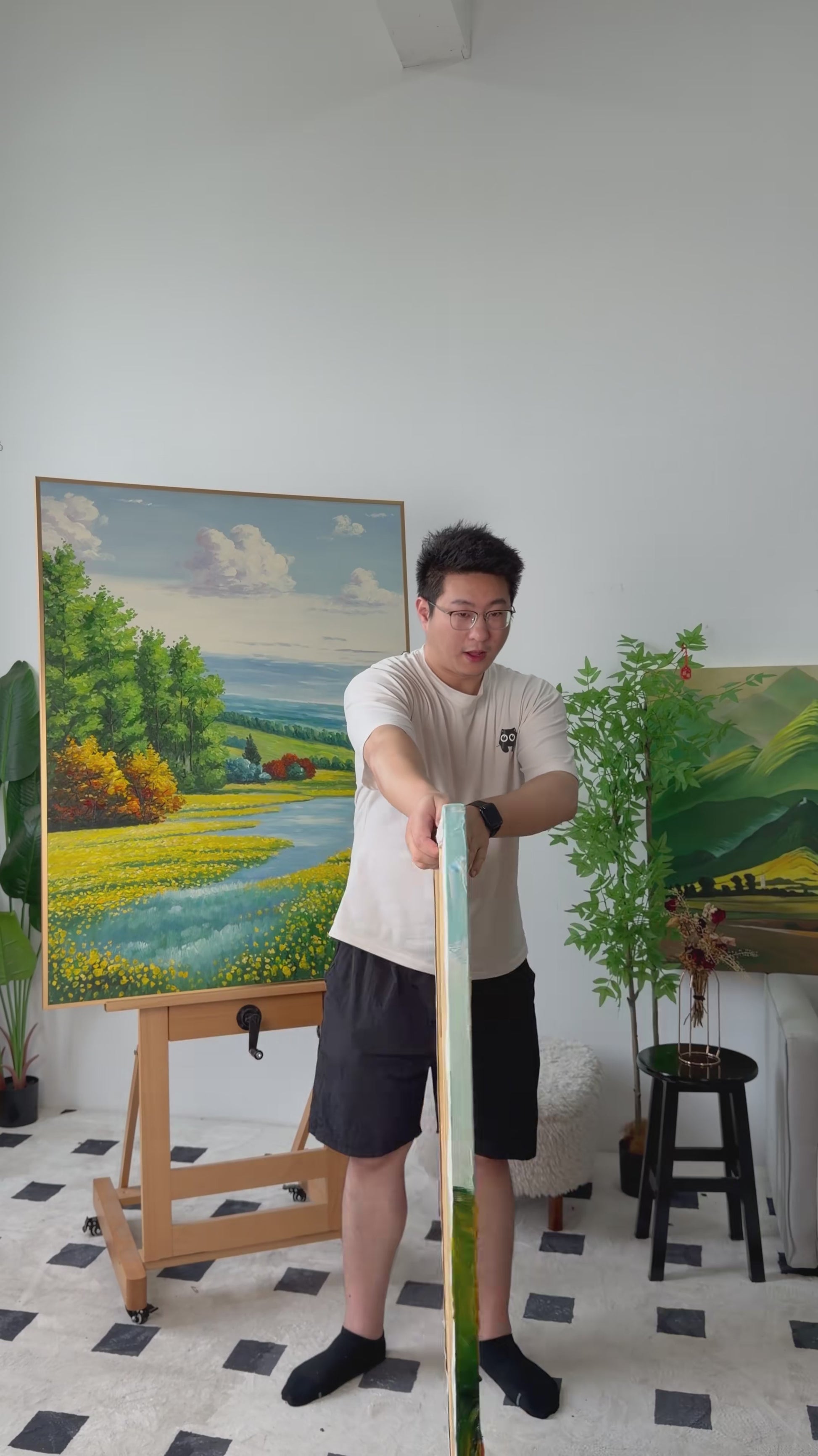 Workshop video showing the hand-painted sunflower field turning from an angled side view to a complete frontal view