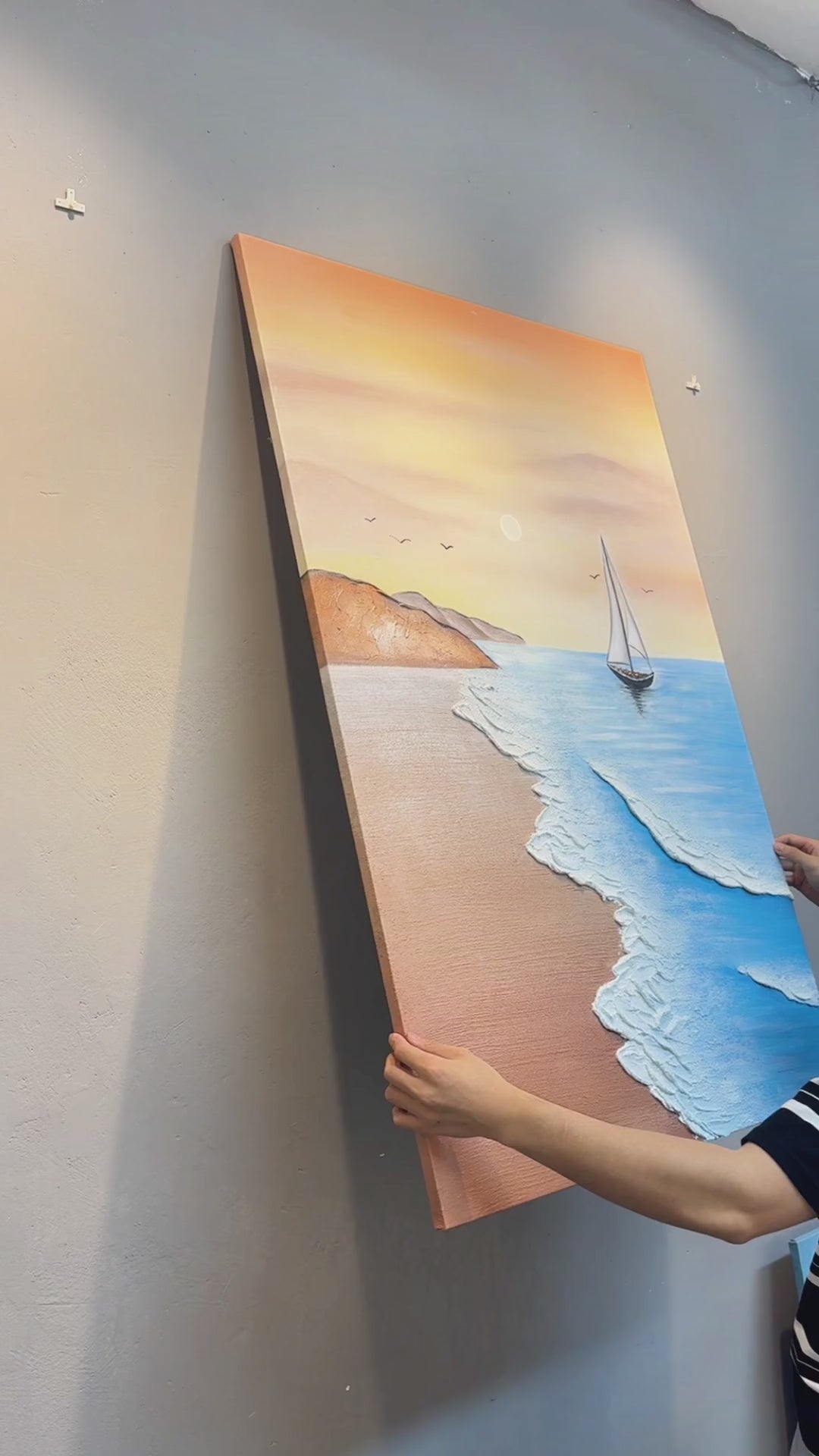 Vertical sailboat painting placed on a wall, surface demonstration and close views of raised foam, pale sun and white sails