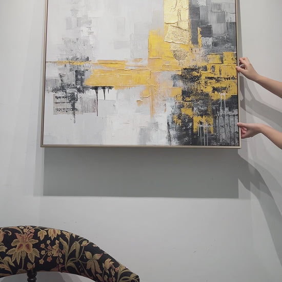 Hanging a square grey and gold abstract, followed by surface details, a hand demonstration and the finished dining-room display