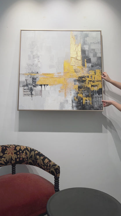 Hanging a square grey and gold abstract, followed by surface details, a hand demonstration and the finished dining-room display