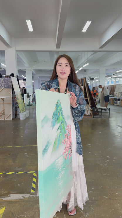 Workshop video showing the hand-painted misty mountain and turquoise lake artwork turning from an angled view to a complete frontal view