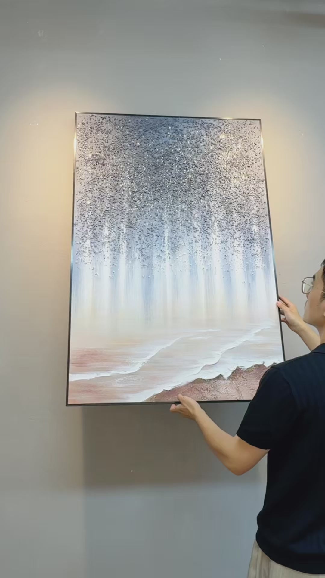 Stardust Shore being hung, followed by close views of its grey flecks and ivory ridges, ending with the complete painting