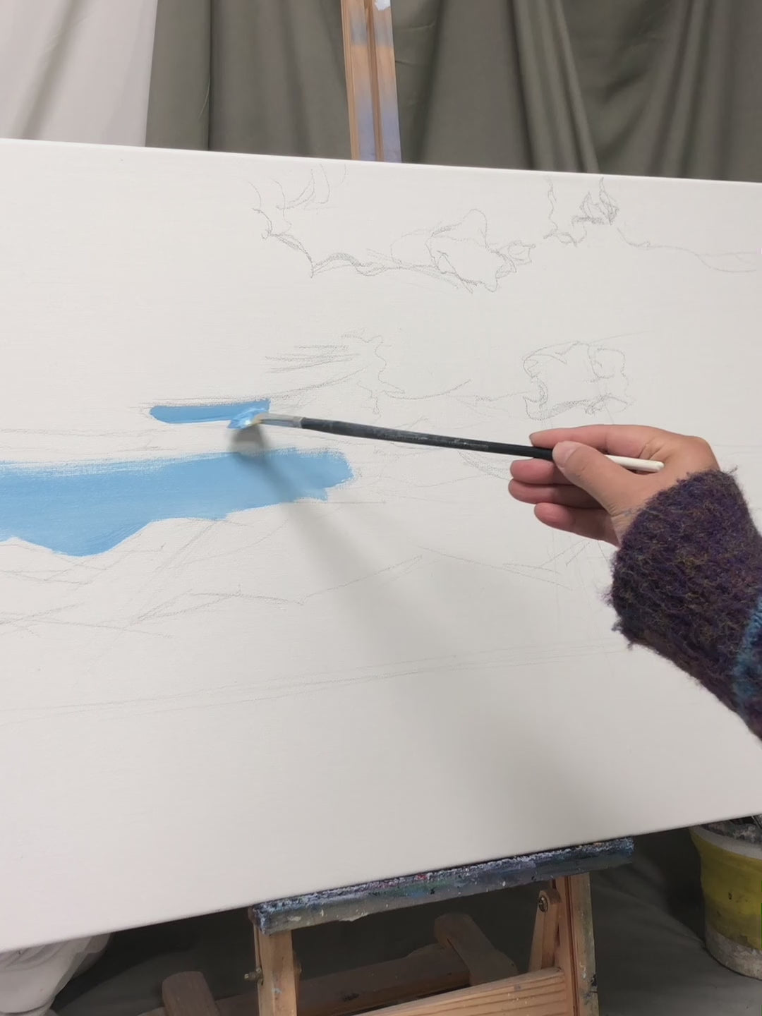 Painting blue clouds, mountain ridges, golden light and a small boat, followed by the complete artwork
