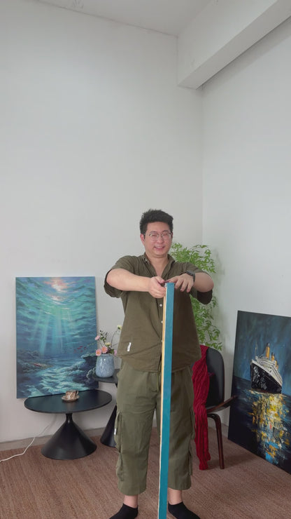 The turquoise and gold boat painting turns into view, followed by a framed product view on an ivory wall
