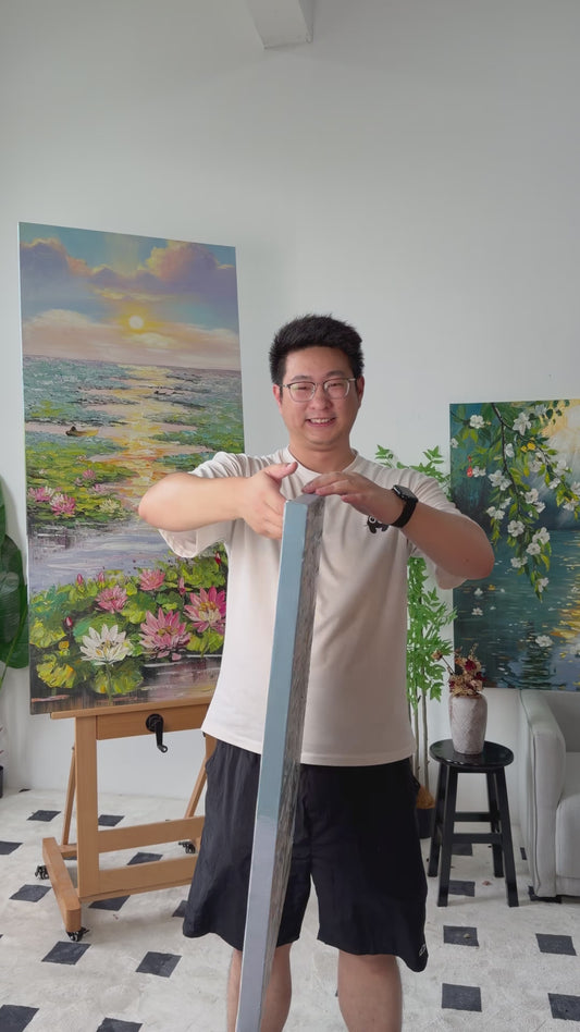 Studio video turning the painting from a narrow side view to a full view of a woman in a flowing dress beside the sea