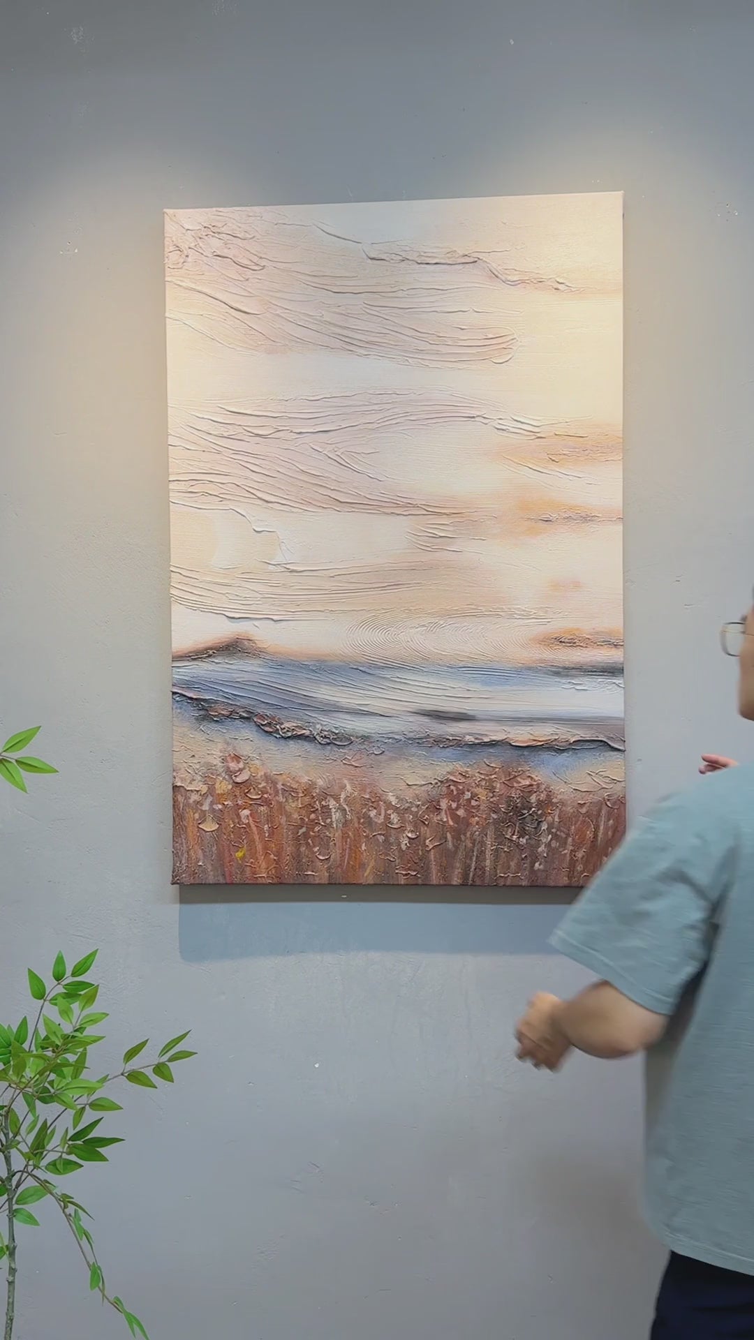 Complete abstract painting, hands holding its edges for an oblique view, close-up ridges and a final full view