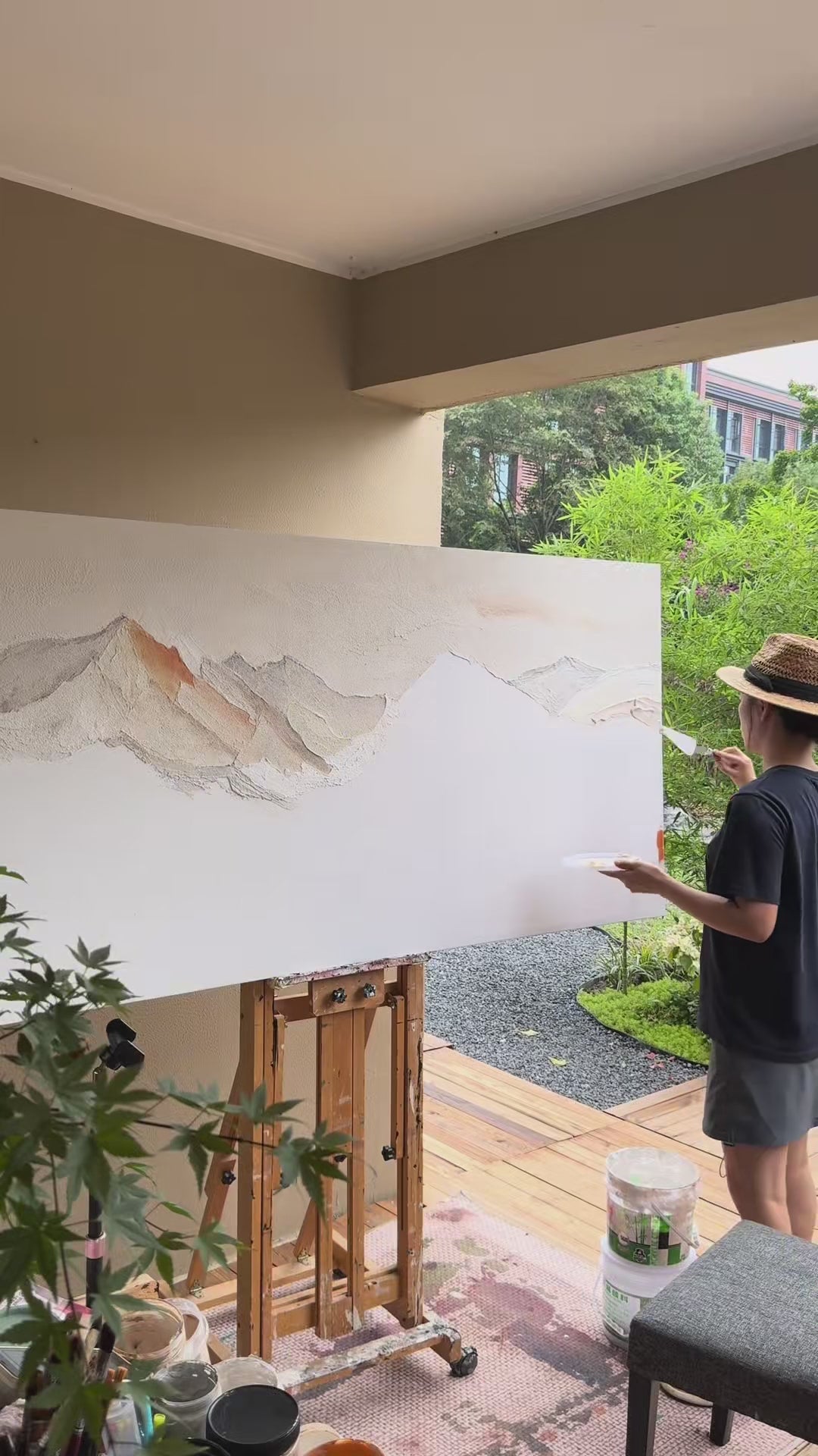 Brushes build pale and copper mountain ridges, followed by finished texture details and the painting outdoors