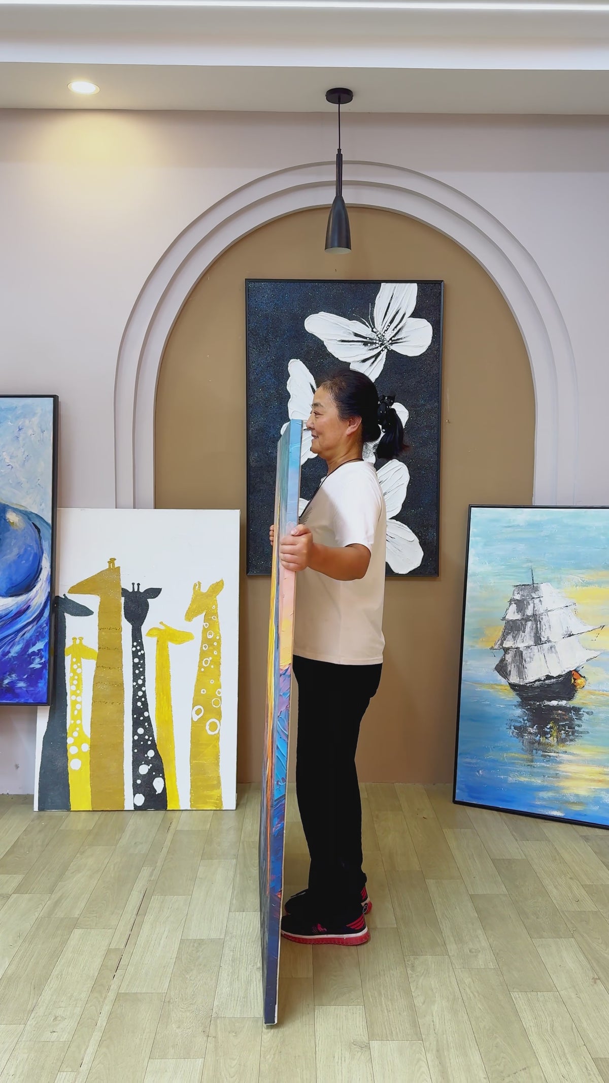 Studio reveal of a yellow and cobalt mountain painting, turning towards a full frontal view with a short held ending