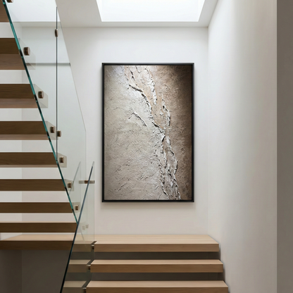 Resonant Strata tall textured artwork beside a modern staircase